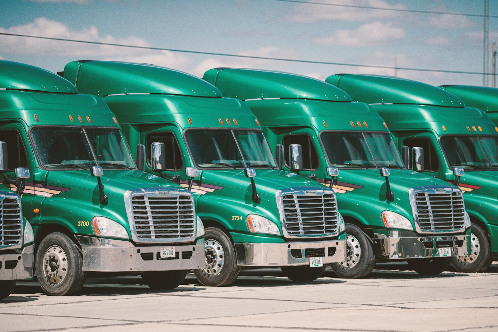 green and white vintage trucks with commercial auto insurance
